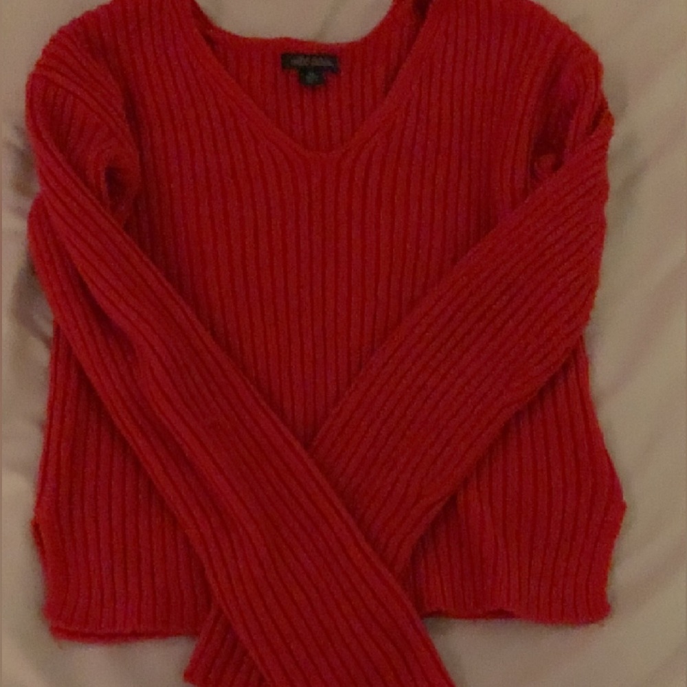 Red knit sweater.